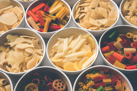 Snack pellets are non-expanded products made with raw materials like cereals, potatoes or vegetable powders, later processed using frying, hot air baking. multicoloured / shaped ready-to-eat snacksの写真素材