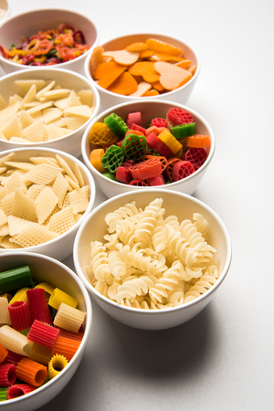 Snack pellets are non-expanded products made with raw materials like cereals, potatoes or vegetable powders, later processed using frying, hot air baking. multicoloured / shaped ready-to-eat snacksの写真素材