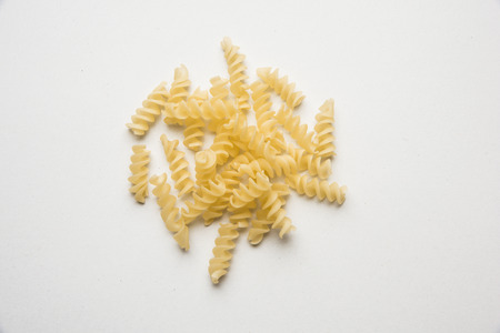 Snack pellets are non-expanded products made with raw materials like cereals, potatoes or vegetable powders, later processed using frying, hot air baking. multicoloured / shaped ready-to-eat snacksの写真素材