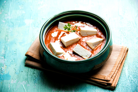 Paneer Butter Masala is a popular North Indian recipe for lunch/dinner made using cottage cheese in red tomato curry. usually served with Rice and chapati/naan. selective focusの写真素材
