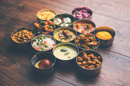 assorted Indian/Pakistani food in stainless steel bowls creating pattern or design, selective focusの写真素材