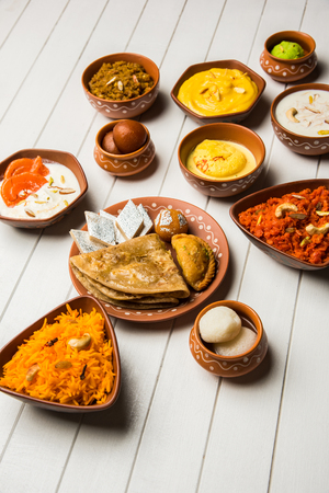 group of Indian Sweet / mithai in terracotta bowlの写真素材