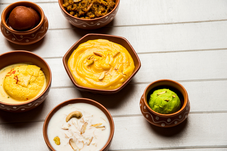 group of Indian Sweet / mithai in terracotta bowlの写真素材