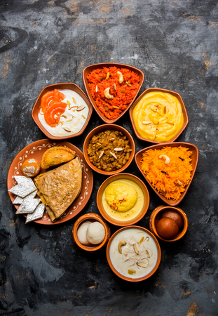 group of Indian Sweet / mithai in terracotta bowlの写真素材