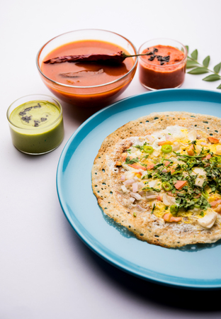 Egg Dosa is a popular south indian non-vegetarian breakfast or meal, served with sambar and chutneyの写真素材