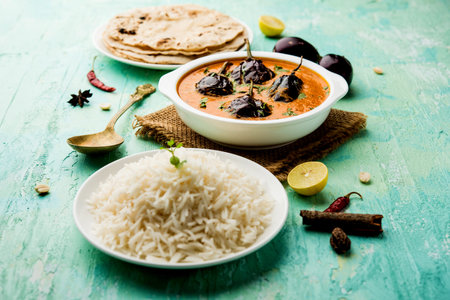 Baingan masala / Eggplant / brinjal curry served with chapati and rice, selective focus