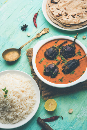 Baingan masala / Eggplant / brinjal curry served with chapati and rice, selective focusの写真素材