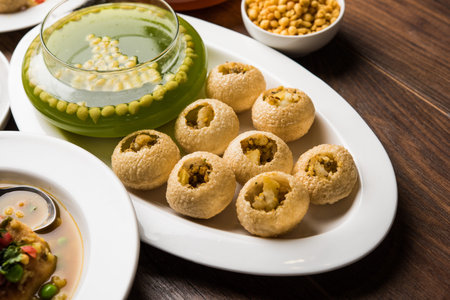 group of Bombay chat food includes golgappa/panipuri, bhel-puri, sev-poori, dahipuri, Ragda pattice,...