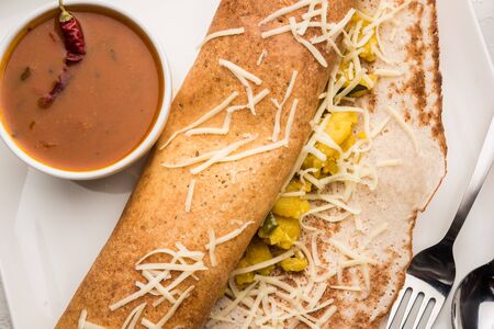 cheese masala dosa recipe with sambar and chutney, selective focusの写真素材