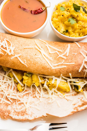 cheese masala dosa recipe with sambar and chutney, selective focus