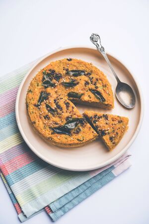 Handvo / handwa is a vegetable cake originating from the Gujarat, India. selective focusの写真素材