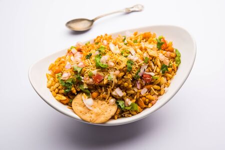 Bhelpuri Chaat/chat is a road side tasty food from India, served in a bowl or plate. selective focusの写真素材