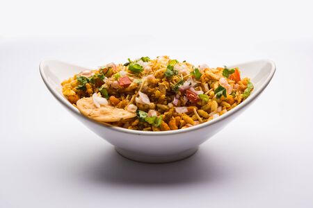 Bhelpuri Chaat/chat is a road side tasty food from India, served in a bowl or plate. selective focusの写真素材
