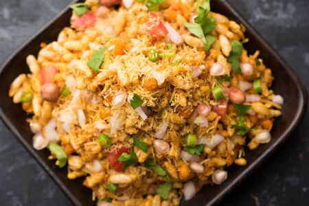 Bhelpuri Chaat/chat is a road side tasty food from India, served in a bowl or plate. selective focusの写真素材