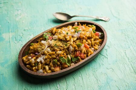Bhelpuri Chaat/chat is a road side tasty food from India, served in a bowl or plate. selective focusの写真素材