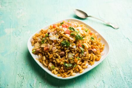 Bhelpuri Chaat/chat is a road side tasty food from India, served in a bowl or plate. selective focusの写真素材