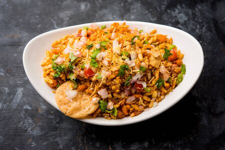 Bhelpuri Chaat/chat is a road side tasty food from India, served in a bowl or plate. selective focusの写真素材