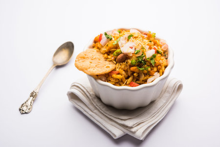 Bhelpuri Chaat/chat is a road side tasty food from India, served in a bowl or plate. selective focus
