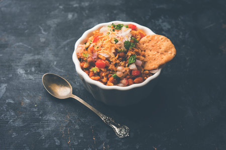 Bhelpuri Chaat/chat is a road side tasty food from India, served in a bowl or plate. selective focus