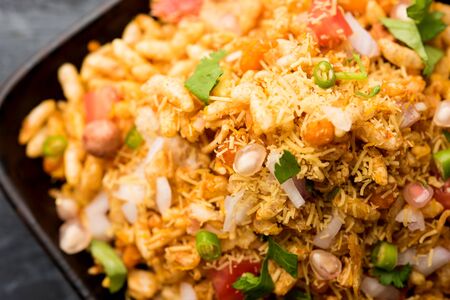 Bhelpuri Chaat/chat is a road side tasty food from India, served in a bowl or plate. selective focusの写真素材