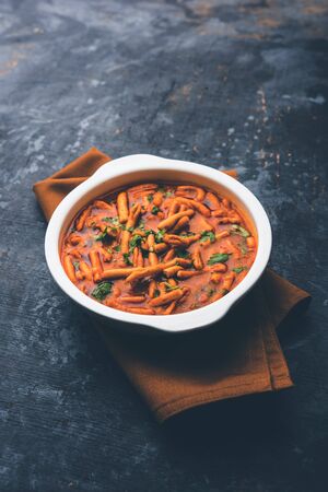 Dhaba style Sev bhaji/sabzi/curry made in tomato curry with gathiya shev,  selective focusの写真素材