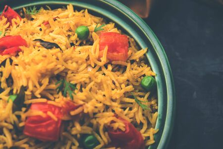 Tomato Pulav or Pilaf made using basmati rice and red tomatoes, served in a bowl. selective focusの写真素材