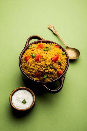 Tomato Pulav or Pilaf made using basmati rice and red tomatoes, served in a bowl. selective focusの写真素材