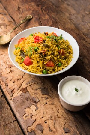 Tomato Pulav or Pilaf made using basmati rice and red tomatoes, served in a bowl. selective focusの写真素材