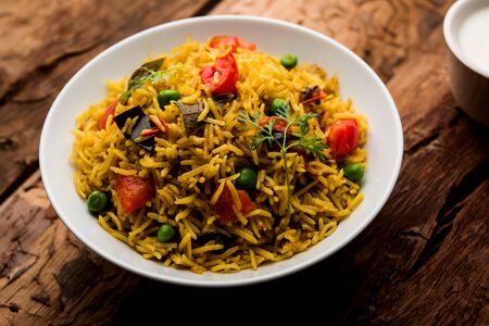 Tomato Pulav or Pilaf made using basmati rice and red tomatoes, served in a bowl. selective focusの写真素材