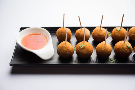 Crispy Veg lollipop recipe made using boiled potato with spices covered with corn flour and bread...