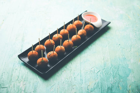 Crispy Veg lollipop recipe made using boiled potato with spices covered with corn flour and bread...