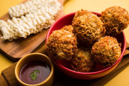 Crispy Noodles/maggie Pakora or pakoda is a popular indochinese street food served with ketchupの写真素材