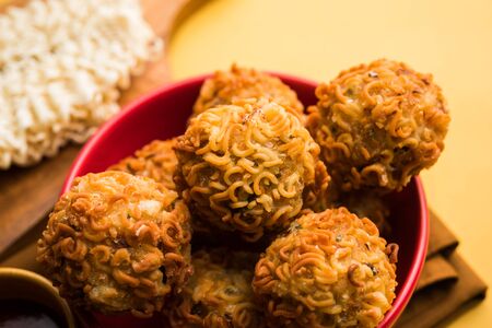 Crispy Noodles/maggie Pakora or pakoda is a popular indochinese street food served with ketchupの写真素材
