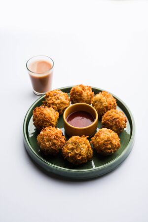 Crispy Noodles/maggie Pakora or pakoda is a popular indochinese street food served with ketchupの写真素材