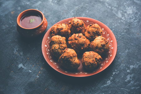 rava Bhajj or bhajiya also known as suji Pakoda or semolina Pakora, served with tomato ketchup....