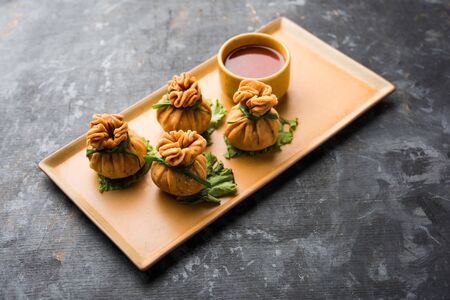 Crispy Potli Samosa or veg money bags are delicious Indian snacks of spiced aloo and mix veggies Or Meat/kheema  stuffed in flaky dough. It's a great creative starter or appetiser. served with ketchupの写真素材