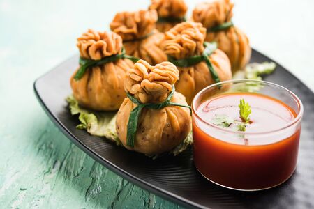 Crispy Potli Samosa or veg money bags are delicious Indian snacks of spiced aloo and mix veggies Or Meat/kheema  stuffed in flaky dough. It's a great creative starter or appetiser. served with ketchupの写真素材
