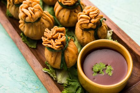 Crispy Potli Samosa or veg money bags are delicious Indian snacks of spiced aloo and mix veggies Or Meat/kheema  stuffed in flaky dough. It's a great creative starter or appetiser. served with ketchupの写真素材