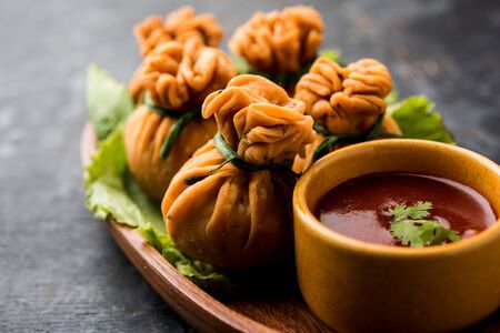 Crispy Potli Samosa or veg money bags are delicious Indian snacks of spiced aloo and mix veggies Or Meat/kheema  stuffed in flaky dough. It's a great creative starter or appetiser. served with ketchupの写真素材