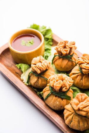 Crispy Potli Samosa or veg money bags are delicious Indian snacks of spiced aloo and mix veggies Or Meat/kheema  stuffed in flaky dough. It's a great creative starter or appetiser. served with ketchupの写真素材