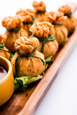 Crispy Potli Samosa or veg money bags are delicious Indian snacks of spiced aloo and mix veggies Or Meat/kheema  stuffed in flaky dough. It's a great creative starter or appetiser. served with ketchupの写真素材