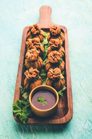 Crispy Potli Samosa or veg money bags are delicious Indian snacks of spiced aloo and mix veggies Or Meat/kheema  stuffed in flaky dough. It's a great creative starter or appetiser. served with ketchupの写真素材