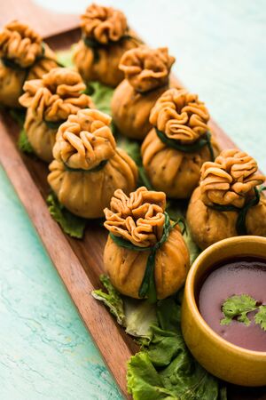 Crispy Potli Samosa or veg money bags are delicious Indian snacks of spiced aloo and mix veggies Or Meat/kheema  stuffed in flaky dough. It's a great creative starter or appetiser. served with ketchupの写真素材
