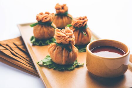 Crispy Potli Samosa or veg money bags are delicious Indian snacks of spiced aloo and mix veggies Or Meat/kheema  stuffed in flaky dough. It's a great creative starter or appetiser. served with ketchupの写真素材