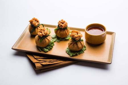 Crispy Potli Samosa or veg money bags are delicious Indian snacks of spiced aloo and mix veggies Or Meat/kheema  stuffed in flaky dough. It's a great creative starter or appetiser. served with ketchupの写真素材