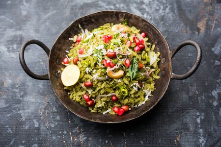 Hariyali Poha / Green Masala Pohe or flattened rice served in a bowl, selective focusの写真素材
