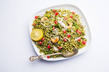 Hariyali Poha / Green Masala Pohe or flattened rice served in a bowl, selective focusの写真素材