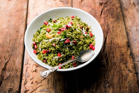 Hariyali Poha / Green Masala Pohe or flattened rice served in a bowl, selective focusの写真素材
