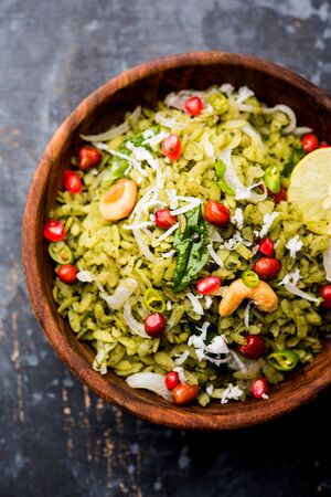 Hariyali Poha / Green Masala Pohe or flattened rice served in a bowl, selective focusの写真素材