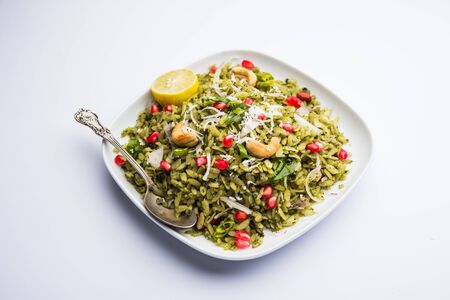 Hariyali Poha / Green Masala Pohe or flattened rice served in a bowl, selective focusの写真素材